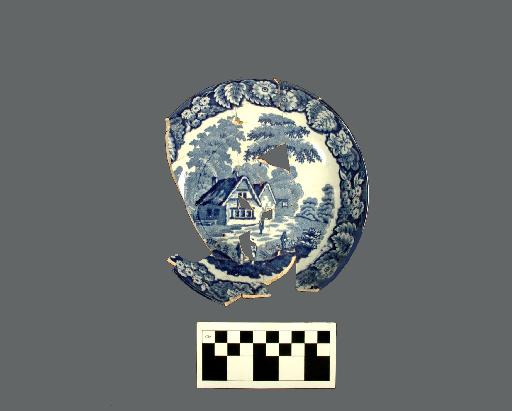 Pearlware saucer with blue transfer print design